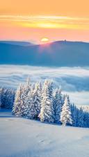 Colorful Winter Sunrise in The Foggy Mountains