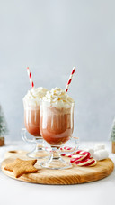 Hot Chocolate  with Whipped Cream Served with A Candy Cane