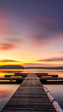 Sunrise lake pier scene view