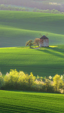 The hillside windmill under the sunset