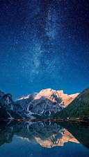 Beautiful First Light on A Mountain Top Against Stars