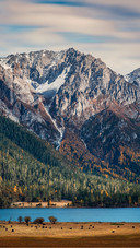 Among the snowcapped peaks and cloud shadows of wuxu lake