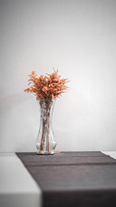 Dry flower in vase, background space on the table