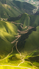 Aerial Photography of Mountain Range Grassland Road
