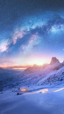A Road Through The Snow-capped Mountains
