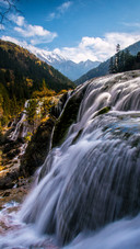 The autumn waterfalls of jiuzhai mountain tint the frosty