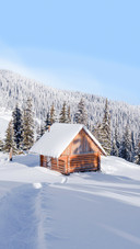 Winter landscape with wooden house in snowy mountains