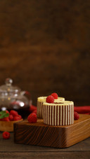 Three chocolate cake with fresh raspberries