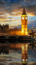 Beautiful Clock Tower by The River in The Evening