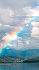 The rainbow over Lugu Lake after the rain
