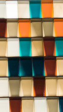 The color blocks are blue orange and white gold