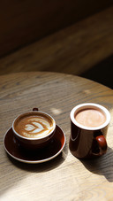 High angle view cups of coffee latte on a wooden table