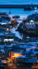 The Beautiful Night View of The Small Town by The Water