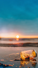 Jar at the beach during sunset