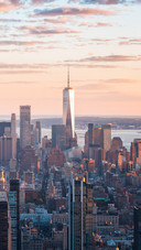 The city and the sea under the sunset glow