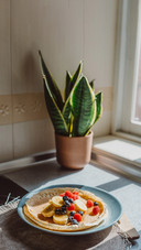 A vertical shot of thin pancakes with berries