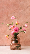 Vase with beautiful pink eustoma flowers
