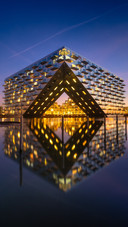 Modern Architecture Mirrors Sky and Water in Deep Blue Hour