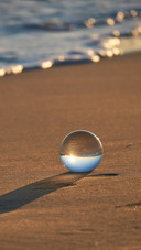 Crystal ball on the beach of Puglia