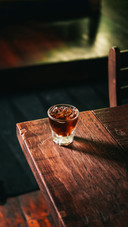 Cold brew coffee with ice cubes on the wooden table