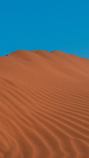 The desert is clouded and the sky is vast