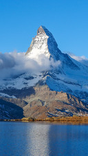 Snowy Crest Above Tranquil Waters