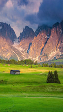 Fantastic spring landscape with wooden chalets