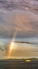 Rainbow on the sea at sunset