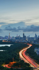 A City Full of Traffic And Lights in The Evening