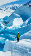 A Woman is Standing on Glacier
