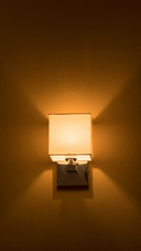An orange lamp on the wall
