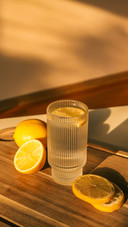 Glass of water with lemon, good morning concept