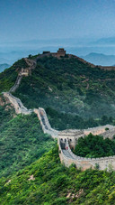 A huge dragon supported by green mountains