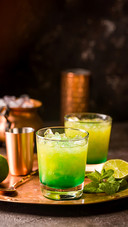 Orange Cocktail Decorated with Lime
