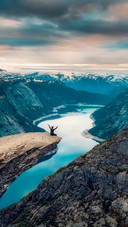 Woman Sitting on The Edge of A Cliff