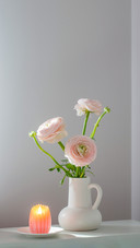 Spring flowers in vase in white modern interior