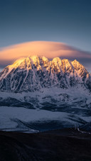 The golden sunlight on the yala snow mountain in summer