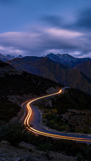 The Car is Driving on The Road at Night