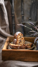 A piece of a sponge or stollen cake with dried fruits