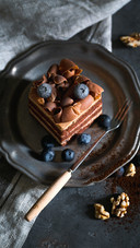 A Plate of Blueberry Chocolate Cake