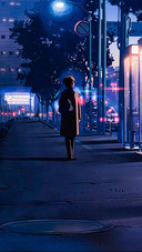A Boy Walking Alone on The Street