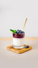 Yoghurt jelly with blueberries on a light background