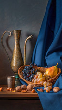 Still life with fruit, wine and drapery