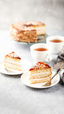 Cake with cream and a decor on a table