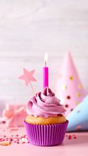 Birthday cupcake with burning candle