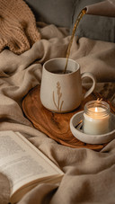 Teapot and Tee Cup in Room with Candle