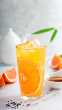 Grapefruit honey jasmine tea in a tall glass