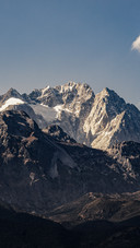 The jade dragon snow mountain is bathed in golden light