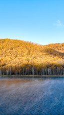 The morning mist over wusu langzi lake