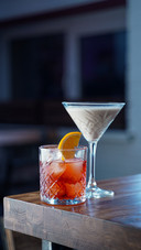 Classic cocktails on a wooden table in a loft bar